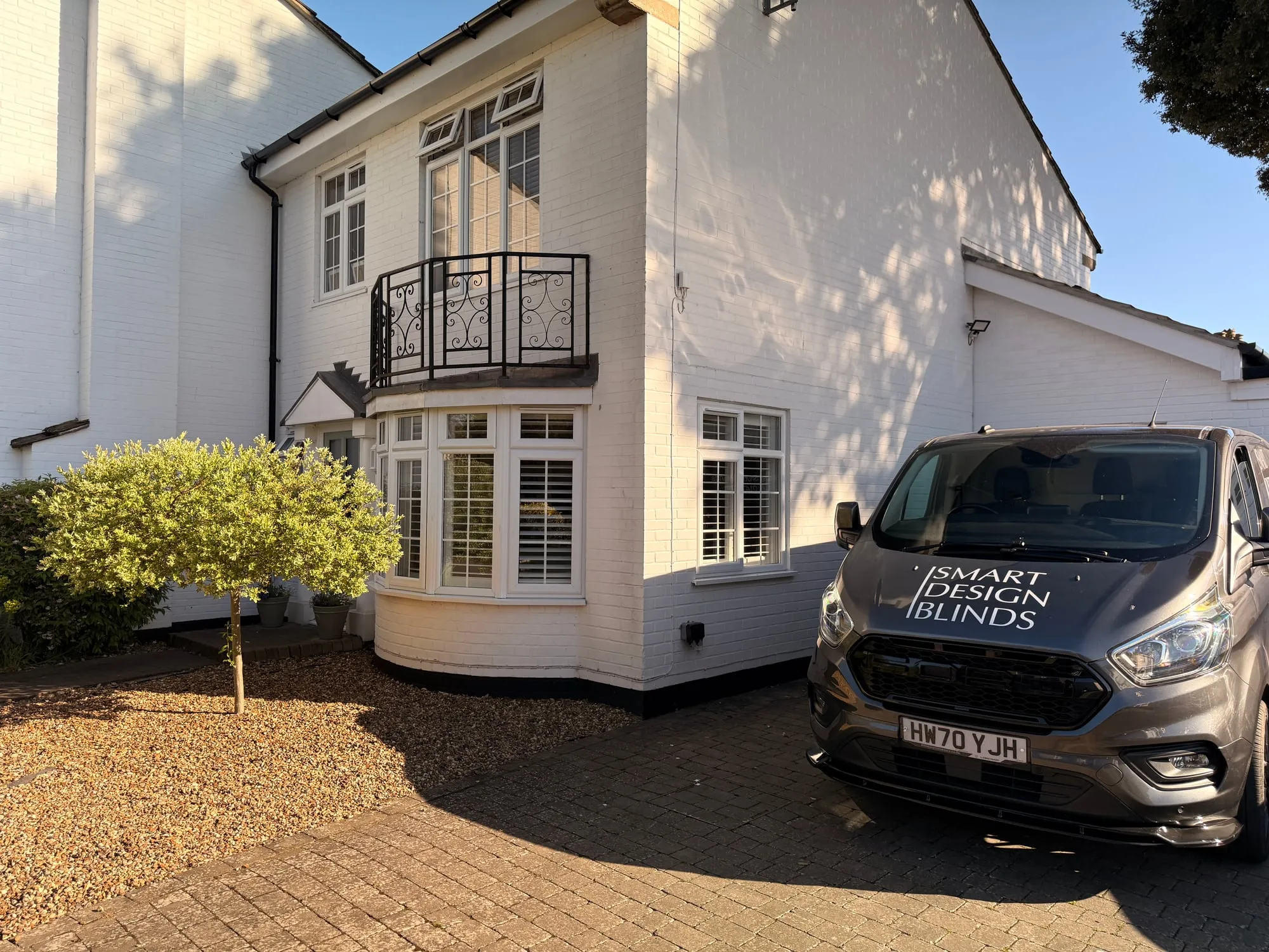 Dan Crooks of Smart Design Blinds on a shutter installation in Ipswich